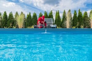 pool technician performing pool inspection checklist
